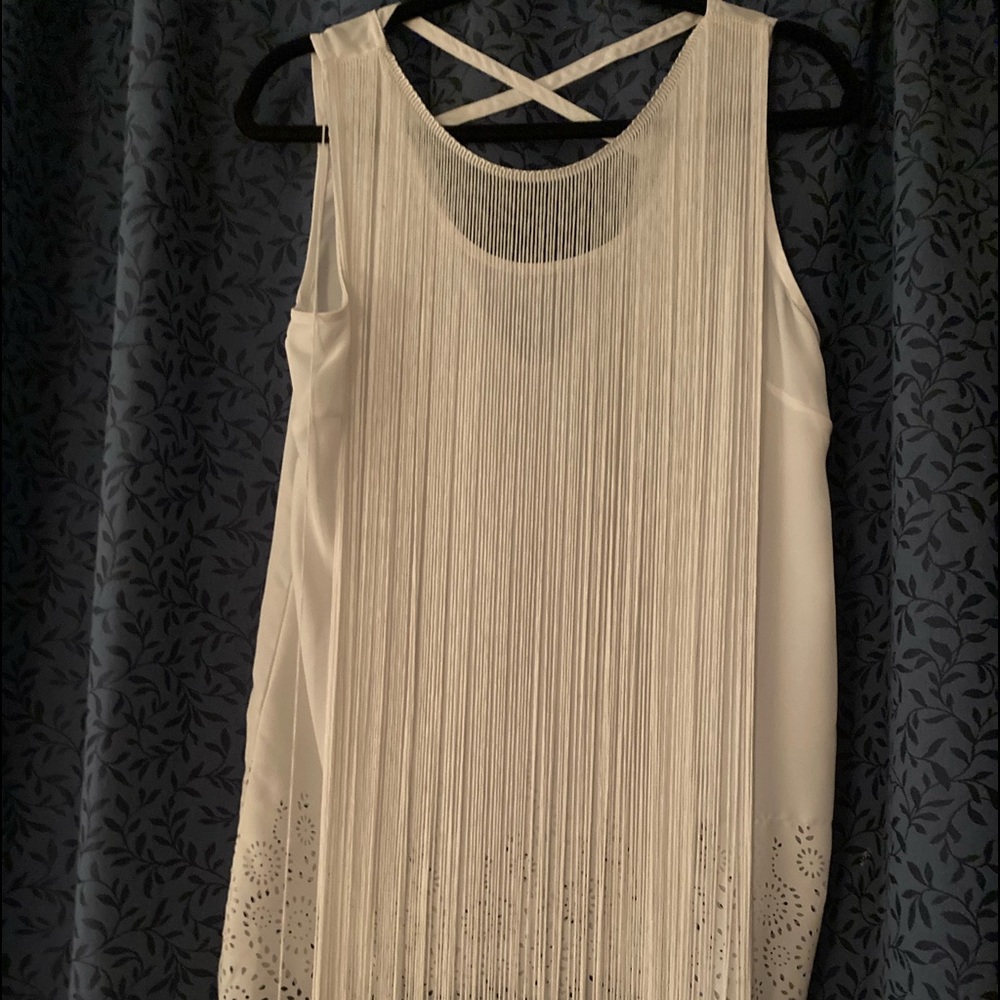 Fun fringe front sleeveless top. Lacy bottom crisscrossed back light and airy.